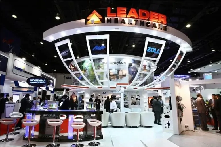 Circular exhibition stand with overhead branding ring